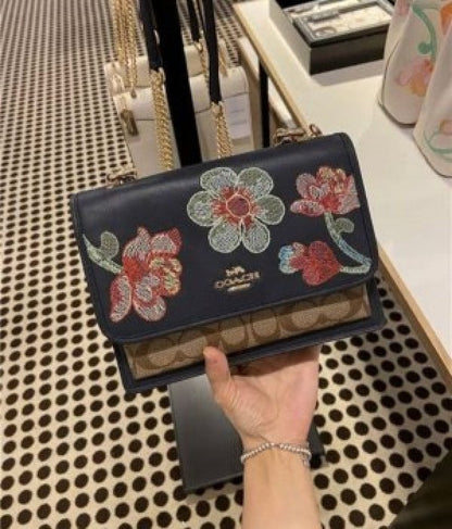 Klare Crossbody Bag In Signature Canvas With Floral Embroidery