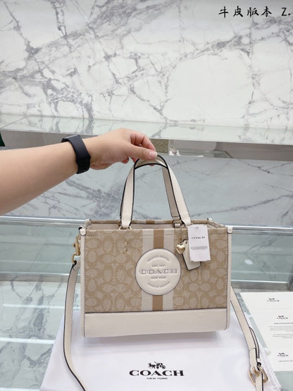 Coaach dempsey carryall signature jacquard stripe and patch with box