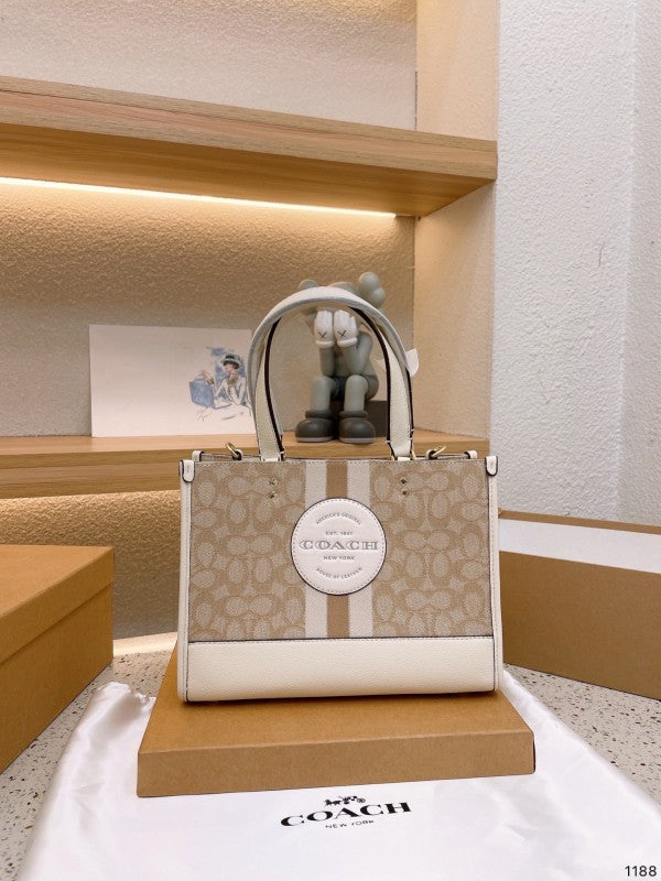 Coaach dempsey carryall signature jacquard stripe and patch with box