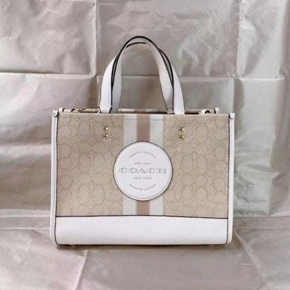 Coaach dempsey carryall signature jacquard stripe and patch with box