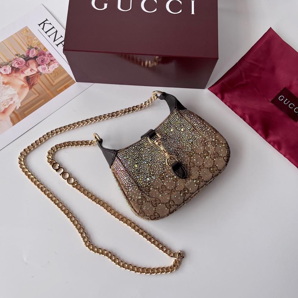 Guccii Jackie Notte mini bag featuring a crystal embellished