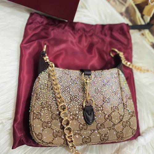 Guccii Jackie Notte mini bag featuring a crystal embellished